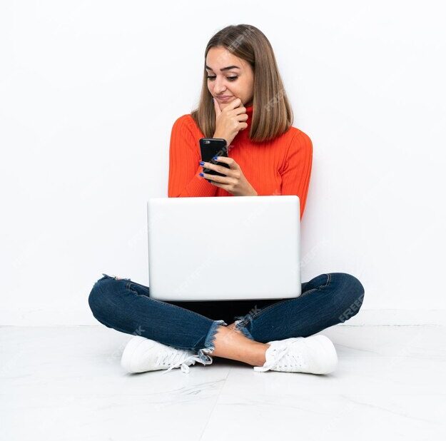 young-caucasian-woman-sitting-floor-with-laptop-thinking-sending-message_1368-327064